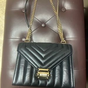 Micheal Kors black Whitney Handbag. Gold hardware.